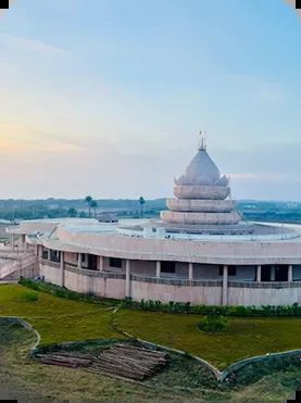 The white temple of Dhyanasthali Dandi under an evening sky